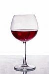 a-glass-of-red-wine-isolated-on-white-background-100130408