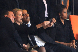 ALTERNATIVE CROP US President  Barack Obama (R) and British Prime Minister David Cameron pose for a picture with Denmark's Prime Minister Helle Thorning Schmidt (C) next to US First Lady Michelle Obama (R) during the memorial service of South African former president Nelson Mandela at the FNB Stadium (Soccer City) in Johannesburg on December 10, 2013. Mandela, the revered icon of the anti-apartheid struggle in South Africa and one of the towering political figures of the 20th century, died in Johannesburg on December 5 at age 95.   AFP PHOTO / ROBERTO SCHMIDTROBERTO SCHMIDT/AFP/Getty Images